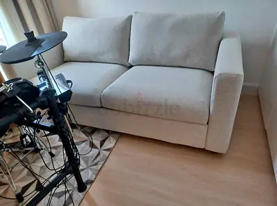 Light beige 2-seater sofa good condition