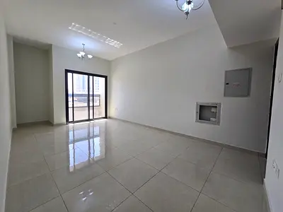 A distinctive two-bedroom apartment with a living room, strategically located behind the Chinese Market and close to Ajman Festival City, in a vibrant