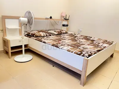 Queen bed frame with attached headboard shelf and bedside table - good condition