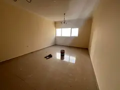 Spacious apartment with balcony and free parking in a prime location in Al Qasimia Al Nadd.