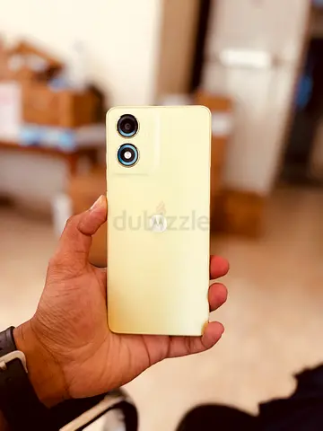 Mint condition Motorola smartphone — light yellow, dual camera