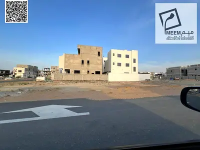 Townhouse plot for sale, freehold, open to all nationalities, registration fees included, large setback, main street