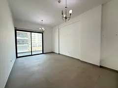 Modern 1BR | Balcony with Open View | Warsan 4