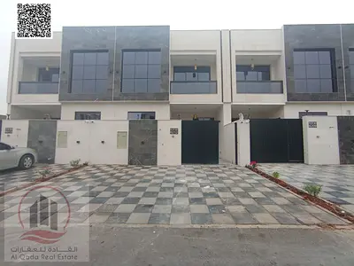 For sale, a villa in Ajman Al Helio, 5 master rooms, a Majles room, a hall, and a maid’s room, freehold for all nationalities,