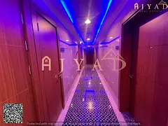 For rent: 2 bedrooms hall apartment in Mushairif Ajman, first occupancy, 2 bathrooms, central AC, ba