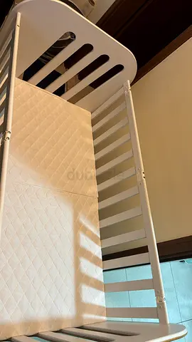 Stylish White Crib , mattress and a side protector for Your Baby
