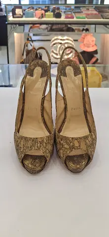 Women’s peep-toe slingback heels by Prada, size 38 (used)