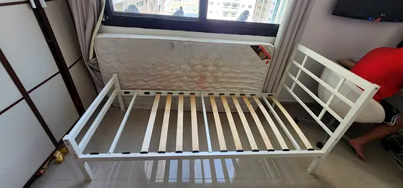 Single white wooden bed frame with slats — good condition