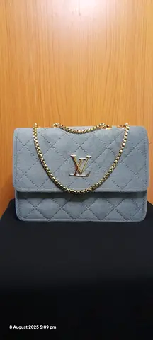 Light Blue Quilted Shoulder Bag with Gold Chain and LV Logo