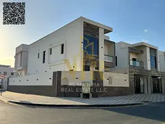 Two-story villa with a rooftop terrace, including electricity, water,, in one of Ajman's most pr