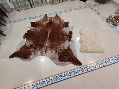 Large Brown  White Cowhide Rug with Small Sheepskin Accent