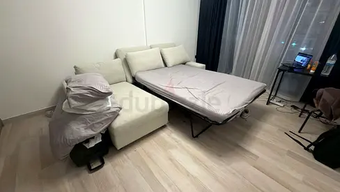 Light beige fabric sofa with pull-out bed - good condition