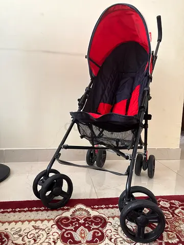 Lightweight red and black standard baby stroller - good condition
