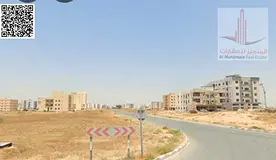 Land for sale in Ajman, Al Amrah, corner plot with 3 streets and an alley, measuring 38,739 sq ft, p