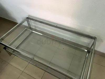 A chrome-plated coffee table with two thick glass shelves. French made.