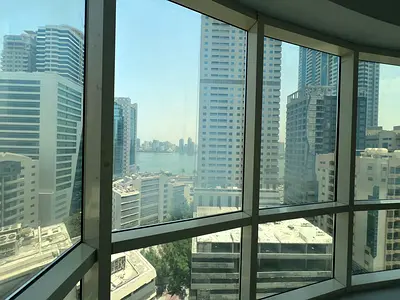 The best sea-view 1-bedroom apartment in Sharjah with a well-distributed layout and spacious design. Large kitchen, central air conditioning, plus 1