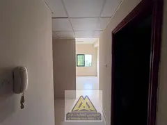 Studio apartment for annual rent in Al Rashidiya, Ajman | Spacious area + separate kitchen + central