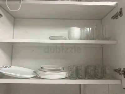 Set of white dinner plates and glassware — used, good condition