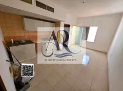 For annual rent: studio with a balcony in Al Rawda 1, next to Al Hamidiya Police Station.