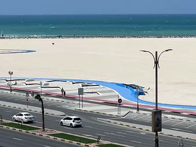 The most beautiful view of Ajman on the Ajman Corniche, on the main road, with modern finishes.
