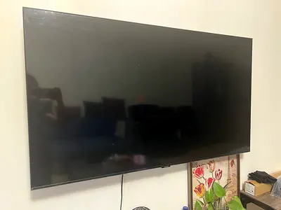 55-65 Wall-Mounted Flat Screen Samsung TV - Good Working Condition