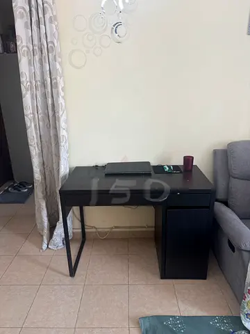 Compact dark wood study desk with storage cabinet