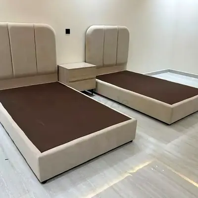 Pair of Beige Fabric Single Beds with Headboards and Nightstand