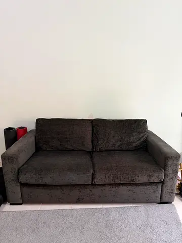 Dark grey 2-seater sofa in good condition