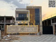 Two-story villa with all registration and ownership fees included, in one of Ajman's most presti