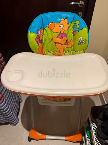 Baby high chair with removable tray — bright animal print