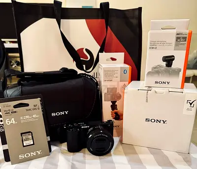 Sony mirrorless camera bundle with accessories (camera, lens, mic, SD card, bag)