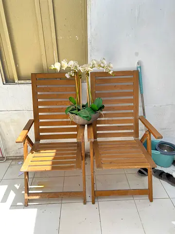 Pair of wooden outdoor folding chairs - good used condition 100 dh