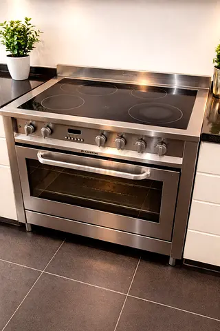 Ariston Stainless steel electric range with ceramic hob and oven - used