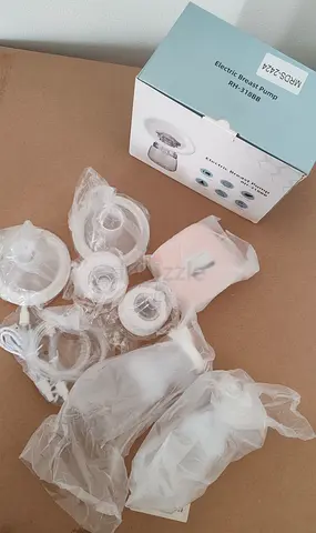 Used Electric Breast Pump with Extra Flanges and Bottles