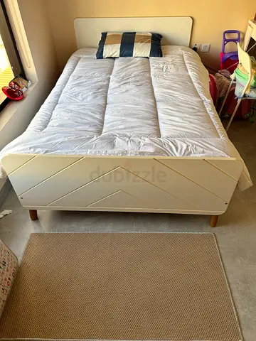 Single white wooden bed frame with mattress included