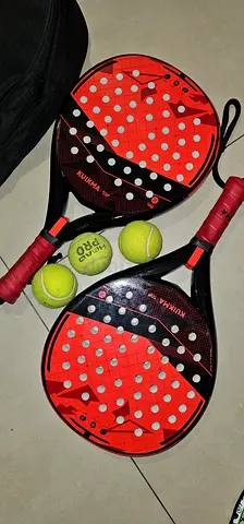 Two padel rackets with bag + three balls - good used condition