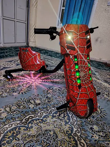 Red Spider-Themed Electric Kids Scooter with LED Lights