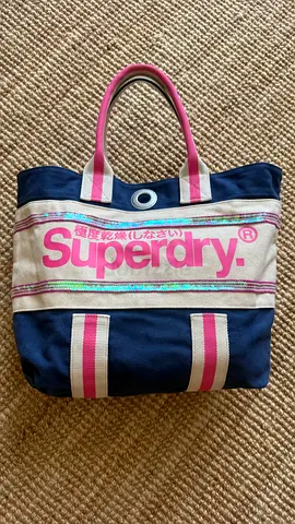 Superdry navy canvas tote bag with pink logo and striped handles