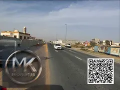 Commercial Plot for Sale – Prime Location Location: IN Al HELIO 2 ON Main Road, directly in front 