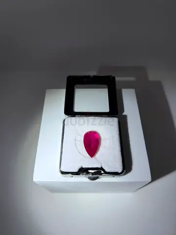 Pear-shaped Pink Ruby (or Ruby-like) Gemstone - 6-8 carat approx in display case