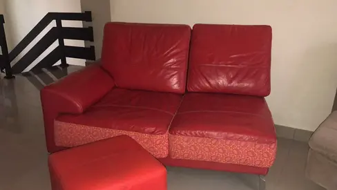 Red Leather sofa with foot stool