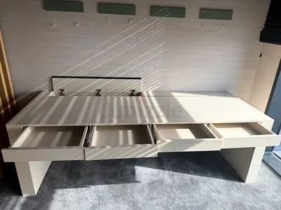 White platform bed base with built-in drawers - good condition