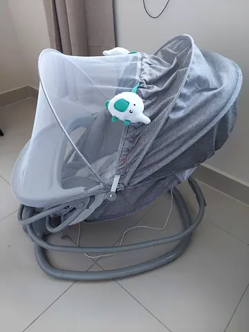 Baby rocker/bouncer with canopy and vibration - gently used