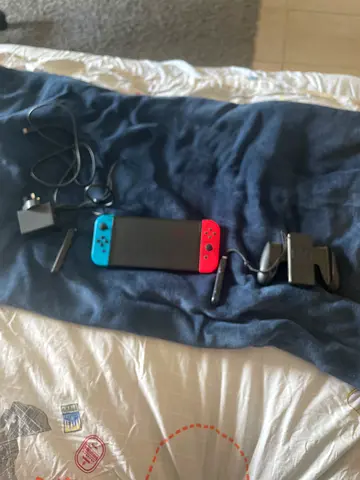 Nintendo Switch (Neon) console, charger and Joy‑Cons - good working condition