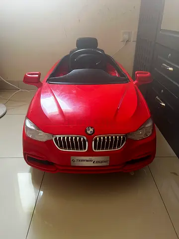 Red BMW-style Electric Ride-On Car for Kids