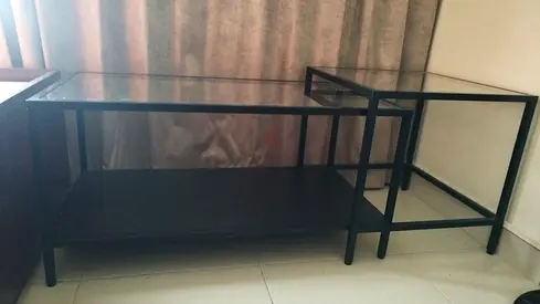 Set of two black metal frame side tables with lower shelf