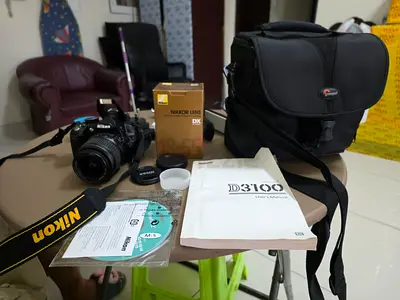 Nikon D3100 DSLR with 18-55mm Lens + Bag  Extras