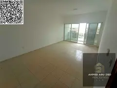 2 bedroom apartment for rent in Al Rawda 2 Ajman opposite Al Kanz Mall with balcony and central AC f