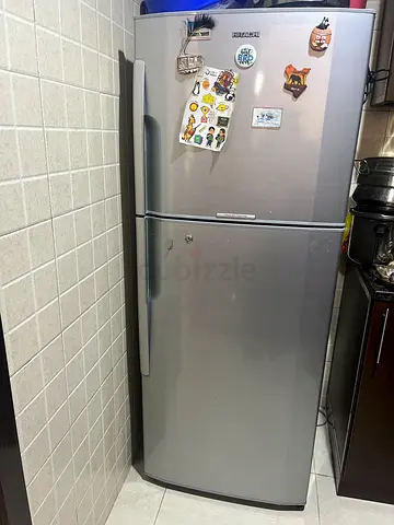 Silver double-door refrigerator with bottom freezer - good condition