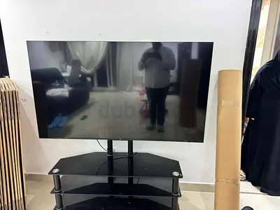 65 inch Flat Panel TV on Glass Stand (Used)